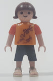 2010 Geobra Playmobil Small Brunette Girl Child Dark Grey Capri Pants Two Tone Orange Shirt with Lizard Design 2 1/8" Tall Toy Figure