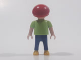 1995 Geobra Playmobil Small Brunette Boy Child Blue Pants Orange and Blue Striped Green Shirt Red Cap 2 1/8" Tall Toy Figure