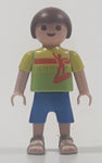 2010 Geobra Playmobil Small Brunette Boy Child Blue Capri Pants Two Tone Green Shirt Escula Red Skateboarder Design 2 1/8" Tall Toy Figure