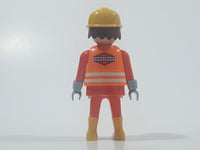 1992 Geobra Playmobil Brunette Hair Bright Orange Pants and Shirt Orange Jacket and Yellow Hard Hat Cap Construction Worker 2 3/4" Tall Toy Figure