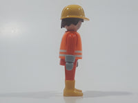 1992 Geobra Playmobil Brunette Hair Bright Orange Pants and Shirt Orange Jacket and Yellow Hard Hat Cap Construction Worker 2 3/4" Tall Toy Figure