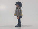 1997 Geobra Playmobil Black Hair Blue and Grey Firefighter 2 3/4" Tall Toy Figure