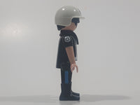 1992 Geobra Playmobil Black Hair Black Uniform White Helmet Police Officer 2 3/4" Tall Toy Figure