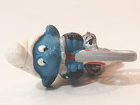 Vintage 1979 Peyo Smurfs Smurf Riding Bicycle 2 5/8" Long PVC Toy Figure