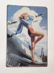 Pin Up Girl Standing On The Wing of a Vintage Airplane 7 3/4" x 11 3/4" Tin Metal Sign