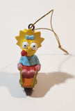 Twentieth Century Fox The Simpsons Maggie Simpson on Sled 1 3/4" PVC Hanging Christmas Tree Ornament