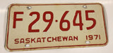 Vintage 1971 Saskatchewan Farm Vehicle Red Lettering White Vehicle License Plate Metal Tag 29 645