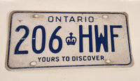 1986 to 1994 Ontario Yours To Discover White with Blue Letters Vehicle License Plate 206 HWF