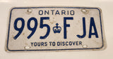 1986 to 1994 Ontario Yours To Discover White with Blue Letters Vehicle License Plate 995 FJA