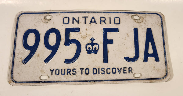 1986 to 1994 Ontario Yours To Discover White with Blue Letters Vehicle License Plate 995 FJA