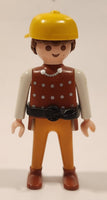 1993 Geobra PlayMobil Brunette Male Brown Spotted Shirt White Sleeves Orange Pants Yellow Hat Toy Figure