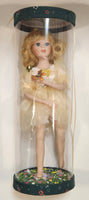 Girl Holding Butterfly in Green Grass Flower Meadow 10" Tall Porcelain Doll In Plastic Tube Display Case