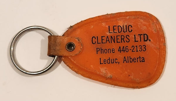 Vintage Leduc Cleaners Ltd. Leduc Alberta "Where Service Dwells and Cleaning Excels" Orange Plastic Fob Keychain Ring
