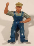 Vintage Sitting Farmer in Blue Overalls 1 3/4" PVC Toy Figure