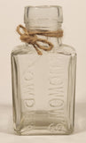 Vintage Kuowow's Powder Heavy Embossed Glass Bottle