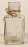 Vintage Kuowow's Powder Heavy Embossed Glass Bottle