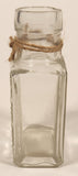 Vintage Kuowow's Powder Heavy Embossed Glass Bottle