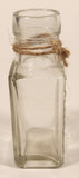 Vintage Kuowow's Powder Heavy Embossed Glass Bottle