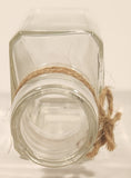 Vintage Kuowow's Powder Heavy Embossed Glass Bottle
