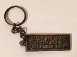 Vintage Speedy Muffler King Sault Ste Marie 100th Store December 1980 Metal Keychain