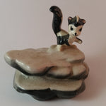 Vintage Porcelain Skunk on a Rock Figurine Has Crazing - Treasure Valley Antiques & Collectibles