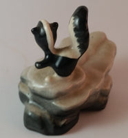 Vintage Porcelain Skunk on a Rock Figurine Has Crazing - Treasure Valley Antiques & Collectibles