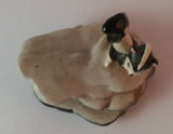 Vintage Porcelain Skunk on a Rock Figurine Has Crazing - Treasure Valley Antiques & Collectibles