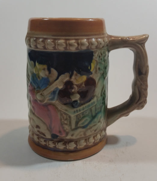 1950s German Oktoberfest Beer Stein Woman Playing Instrument with Man in Hat Made in Japan. - Treasure Valley Antiques & Collectibles