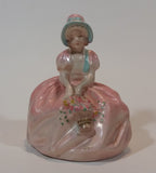 Vintage Chalkware Sitting Girl in Victorian Pink Dress with Bonnet and Flower Basket Figurine - Treasure Valley Antiques & Collectibles