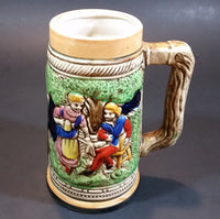 1950s German Oktoberfest Beer Stein Woman Serving Beer to Man Sitting - Japan 6 3/8" Tall - Treasure Valley Antiques & Collectibles