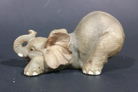 Elephant Figurine Laying Down with Trunk Upwards Marked ©97 WUI - Treasure Valley Antiques & Collectibles