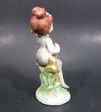 Vintage Victorian Girl Sitting on a Fence Playing a Mandolin Ceramic Figurine - Treasure Valley Antiques & Collectibles