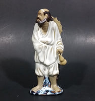 Vintage Balding Man with a Beard in a White Robe With a Tan Hat Ceramic Figurine - Treasure Valley Antiques & Collectibles