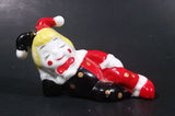 Decorative Ceramic Jester Laying Down Sleeping Dreaming Figurine w/ Red & Black Costume - Treasure Valley Antiques & Collectibles