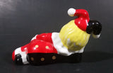 Decorative Ceramic Jester Laying Down Sleeping Dreaming Figurine w/ Red & Black Costume - Treasure Valley Antiques & Collectibles