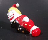 Decorative Ceramic Jester Laying Down Sleeping Dreaming Figurine w/ Red & Black Costume - Treasure Valley Antiques & Collectibles