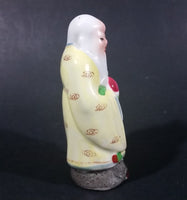 Vintage Chinese God Shou Wiseman in a Yellow Robe with Red Staff holding Fruit Ceramic Figurine - Treasure Valley Antiques & Collectibles