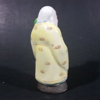 Vintage Chinese God Shou Wiseman in a Yellow Robe with Red Staff holding Fruit Ceramic Figurine - Treasure Valley Antiques & Collectibles