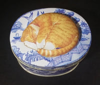 Collectible Blue Willow Blue and White Tin With Orange and White Sleeping Kitty Cat - Treasure Valley Antiques & Collectibles