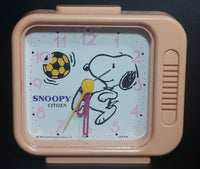 Vintage 1958 Citizen United Feature Syndicate Snoopy Playing Soccer Pink Alarm Clock Collectible - Treasure Valley Antiques & Collectibles