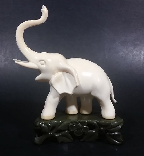 Vintage White Ivory Look Plastic Elephant on Rock Looking Stand with Trunk Up Made in Hong Kong - Treasure Valley Antiques & Collectibles