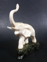Vintage White Ivory Look Plastic Elephant on Rock Looking Stand with Trunk Up Made in Hong Kong - Treasure Valley Antiques & Collectibles