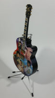 Collectible Elvis Presley Rockin' Through The Years Limited Edition 12" Musical Guitar with Stand and Certificate