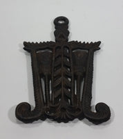 Antique Decorative Cast Iron Hot Plate Pot Holder Hanging with Brooms a Heart and Ornate Design - Treasure Valley Antiques & Collectibles