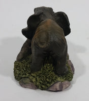 Elephant with Tusks Pulling a Log With It's Trunk Resin Figurine - SABRE - Treasure Valley Antiques & Collectibles