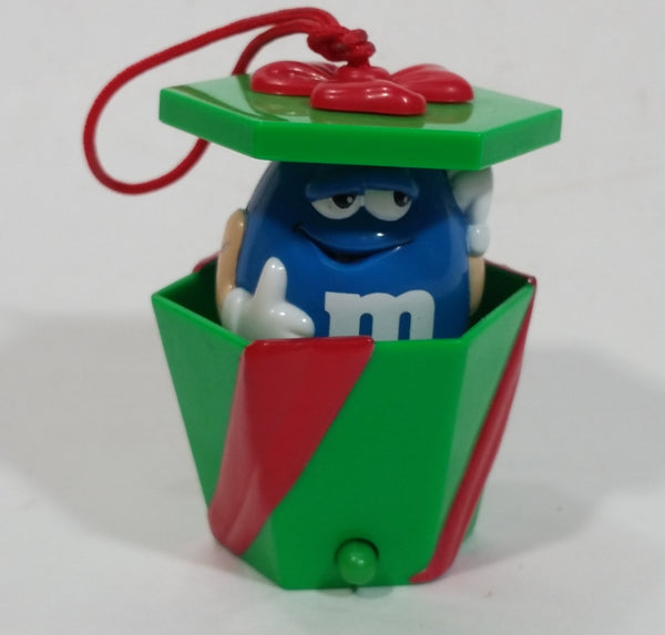 Mars M&M's Chocolate Peanut Candies Pop Up Blue Character in Green Red Ribbon Wrapped Present Gift Christmas Tree Hanging Ornament