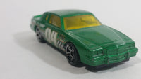 2010 Hot Wheels Race World Movie Stunts '84 Pontiac Grand Prix Metallic Green Die Cast Toy Car Vehicle