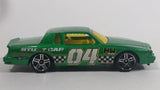 2010 Hot Wheels Race World Movie Stunts '84 Pontiac Grand Prix Metallic Green Die Cast Toy Car Vehicle