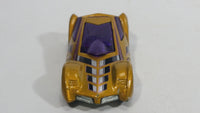 2004 Hot Wheels Sinistra Gold and Purple Die Cast Toy Car Vehicle