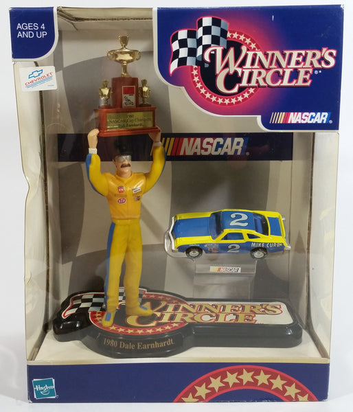 1999 NASCAR Winner's Circle 1980 Champion Dale Earnhardt 7 1/2" Figure with 1/64 Scale Chevrolet Monte Carlo #2 Die Cast Toy Car Vehicle In Original Packaging